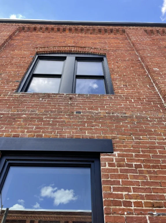 Brick storefront exterior pressure washing