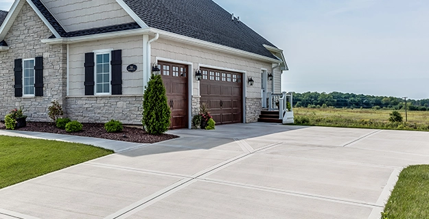 Concrete driveway pressure washing — before and after